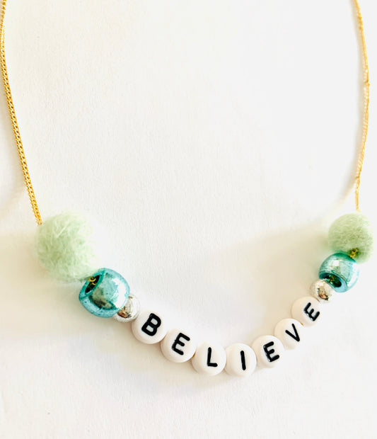 believe pom pom necklace green