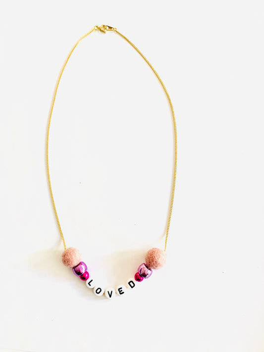 loved pink pom pom necklace